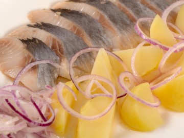 Hering mit Speck- und Zwiebelsauce